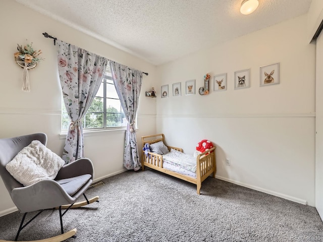 4904 E 125th Ave, Thornton, CO 80241 - carpeted bedroom with a textured ceiling and baseboards