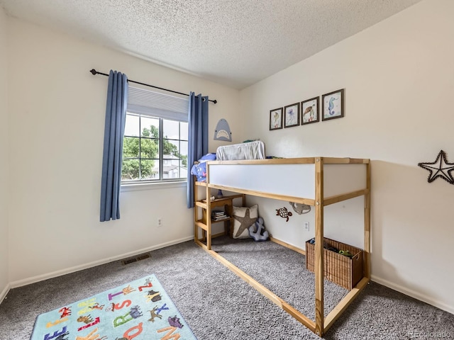 4904 E 125th Ave, Thornton, CO 80241 - bedroom featuring carpet flooring and a textured ceiling