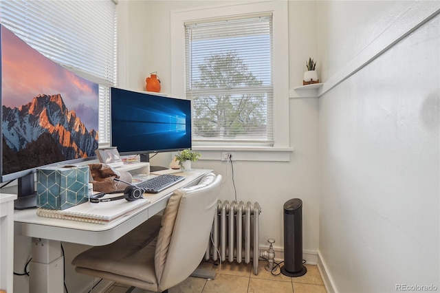 tiled home office with radiator and baseboards