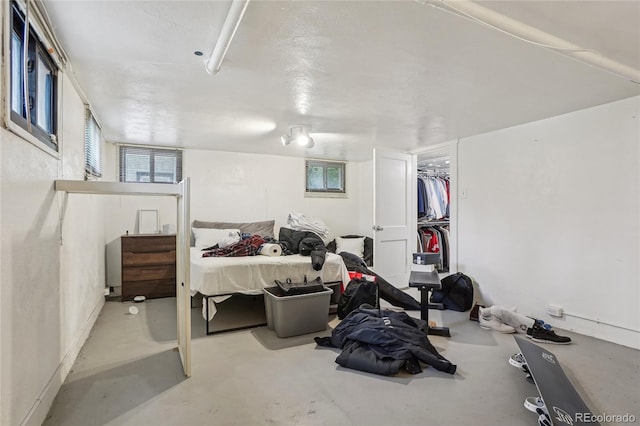 bedroom featuring concrete floors