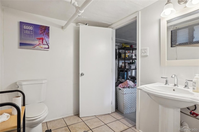 bathroom featuring tile patterned floors and toilet