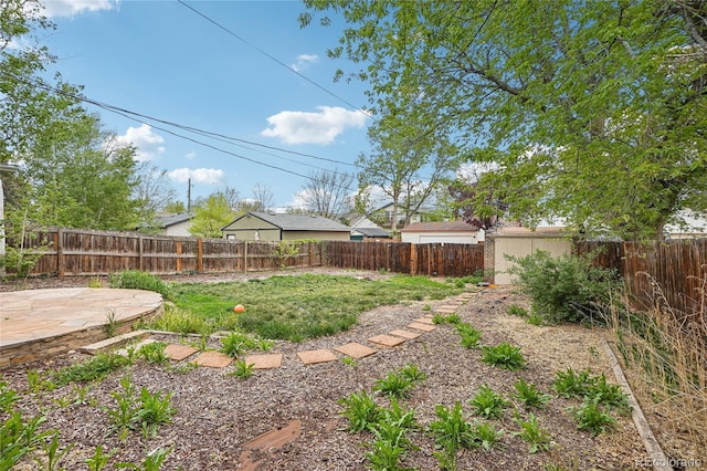 fenced backyard with a patio