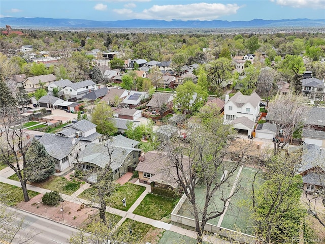 view of property location featuring nearby suburban area and mountains