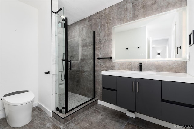 bathroom with toilet, a stall shower, vanity, and tile walls