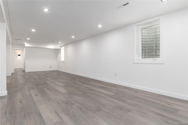 interior space with visible vents, baseboards, light wood-style flooring, and recessed lighting