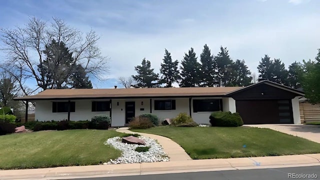 5886 S Logan St, Centennial, CO 80121 - ranch-style home with a front lawn, a garage, and concrete driveway