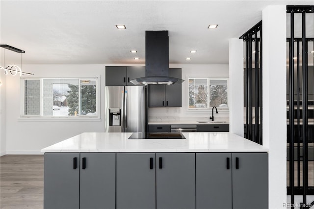 5886 S Logan St, Centennial, CO 80121 - kitchen featuring plenty of natural light, a sink, island exhaust hood, appliances with stainless steel finishes, and gray cabinets