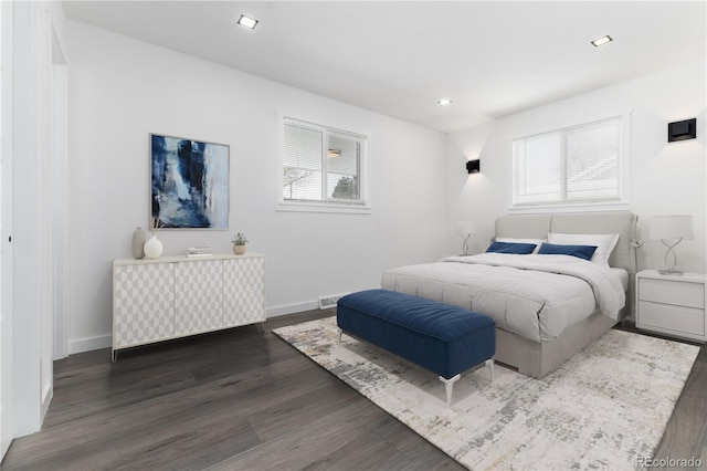 5886 S Logan St, Centennial, CO 80121 - bedroom with baseboards, multiple windows, and dark wood-type flooring
