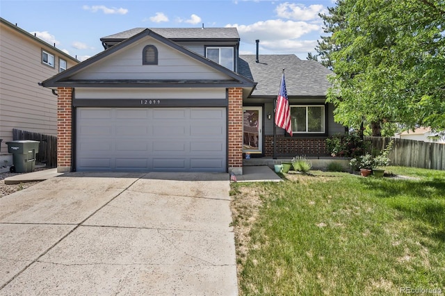 12099 Forest St, Thornton, CO 80241 - view of front of home with brick siding, driveway, a garage, and a shingled roof