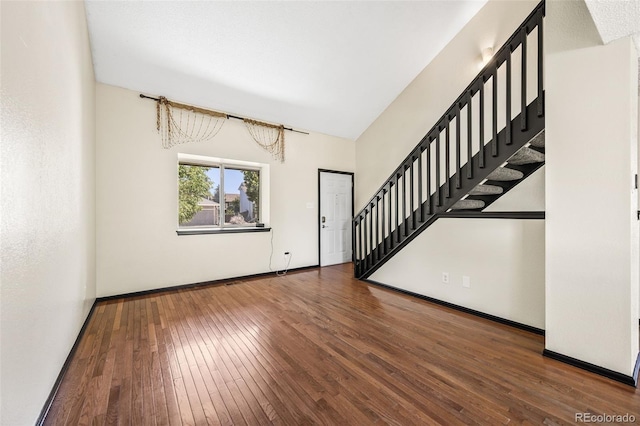 12099 Forest St, Thornton, CO 80241 - entryway with stairs, hardwood / wood-style flooring, and lofted ceiling