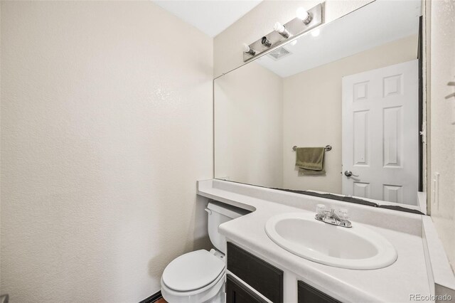 12099 Forest St, Thornton, CO 80241 - half bath featuring vanity and toilet