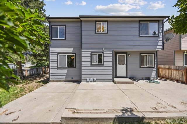 12099 Forest St, Thornton, CO 80241 - view of front of property featuring a patio area and a fenced backyard