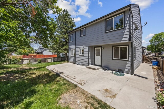 12099 Forest St, Thornton, CO 80241 - back of property featuring a patio area and a fenced backyard