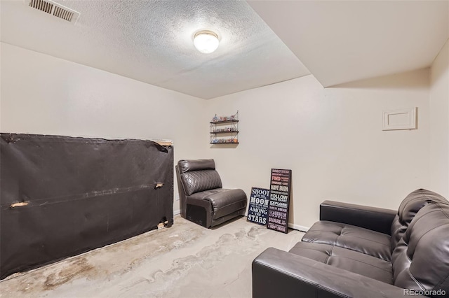 cinema room featuring a textured ceiling