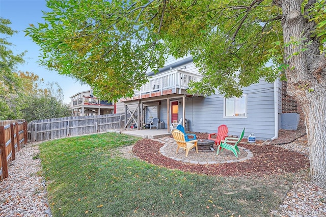 view of yard with a patio area, a deck, and a fire pit