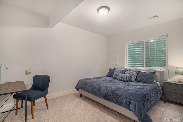 6027 N Netherland Ct, Aurora, CO 80019 - bedroom with light colored carpet and beam ceiling