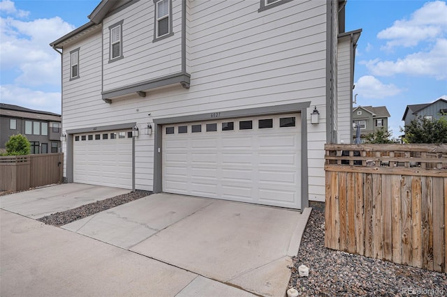 6027 N Netherland Ct, Aurora, CO 80019 - garage featuring driveway