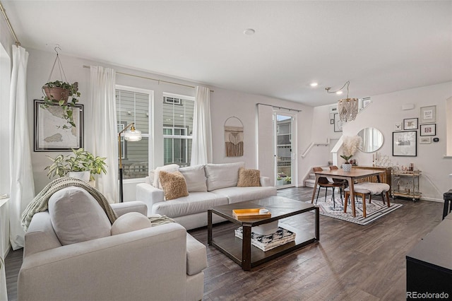6027 N Netherland Ct, Aurora, CO 80019 - living area featuring dark wood finished floors, plenty of natural light, a chandelier, and recessed lighting