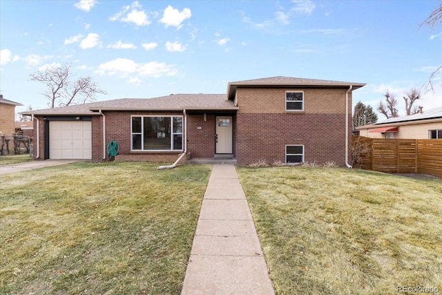 view of front of home featuring a front lawn, an attached garage, fence, and brick siding