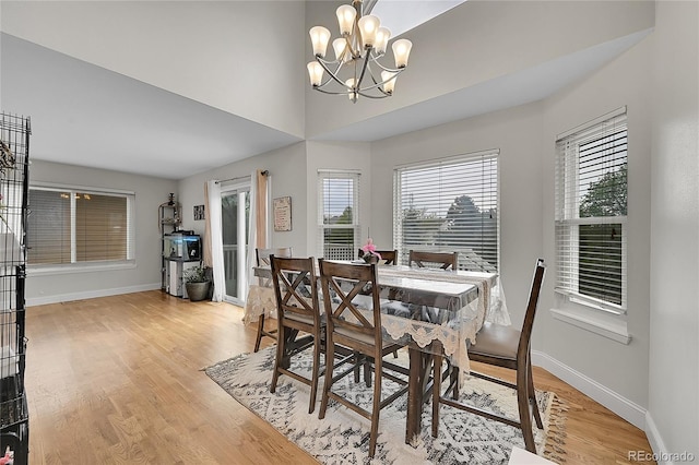 3615 Birnamwood Dr, Colorado Springs, CO 80920 - dining space with a chandelier, light wood-style floors, and baseboards