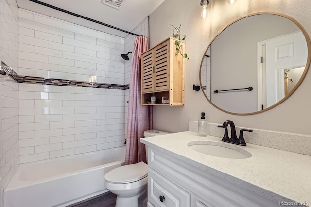 full bath with visible vents, vanity, toilet, and shower / bath combo with shower curtain