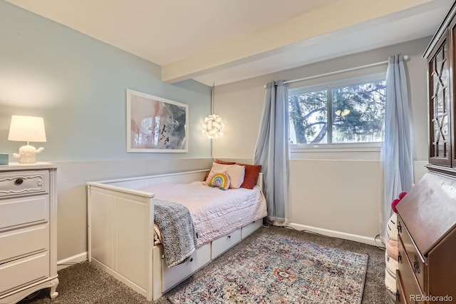 carpeted bedroom with beam ceiling and baseboards