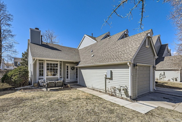 view of front of home with concrete driveway, a shingled roof, a chimney, and an attached garage