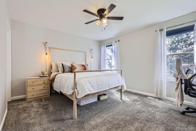 carpeted bedroom featuring a ceiling fan and baseboards