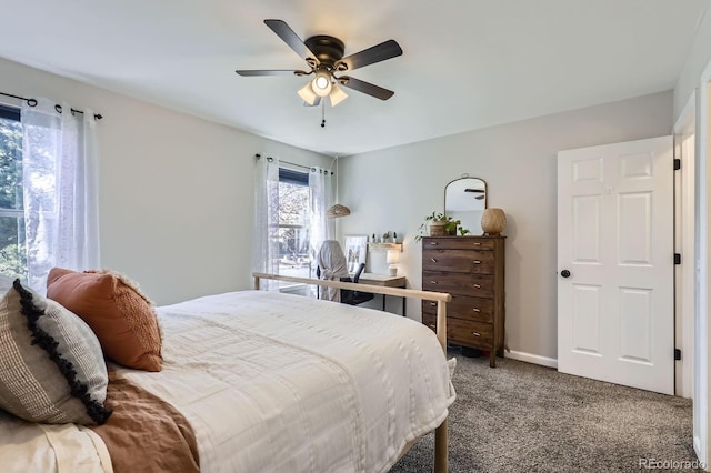 carpeted bedroom featuring a ceiling fan and baseboards