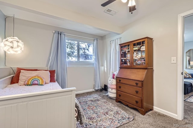 bedroom with carpet floors, visible vents, baseboards, and a ceiling fan