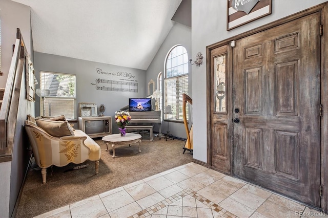 1744 Brookside Dr, Highlands Ranch, CO 80126 - foyer featuring light carpet, light tile patterned floors, and high vaulted ceiling