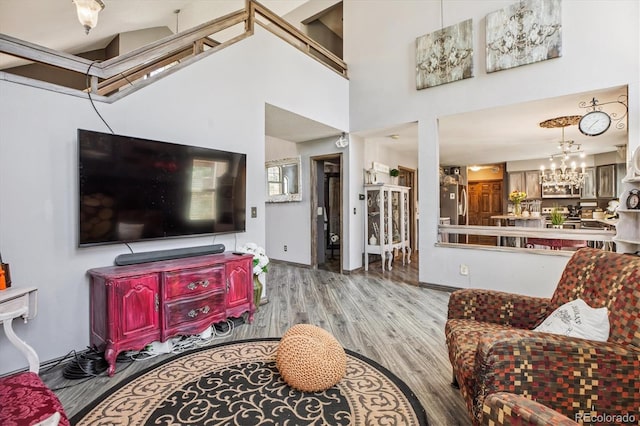 1744 Brookside Dr, Highlands Ranch, CO 80126 - living area featuring wood finished floors and a chandelier