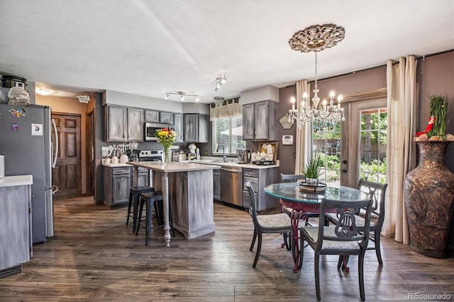 1744 Brookside Dr, Highlands Ranch, CO 80126 - dining space with a chandelier and dark wood-style floors