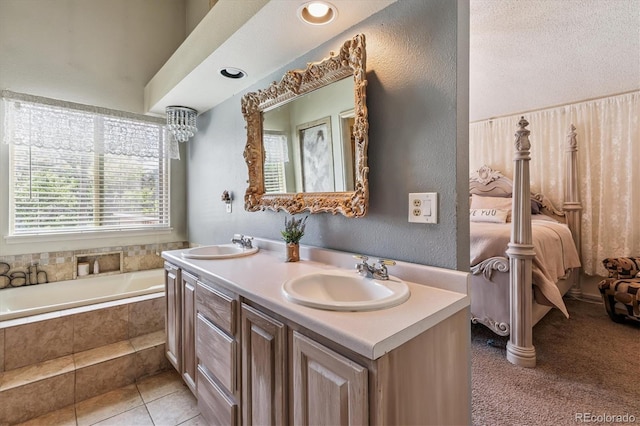 1744 Brookside Dr, Highlands Ranch, CO 80126 - bathroom with double vanity, a textured wall, and tiled tub