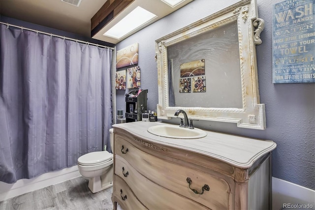1744 Brookside Dr, Highlands Ranch, CO 80126 - full bathroom with vanity, wood finished floors, a textured wall, and shower / bath combination with curtain