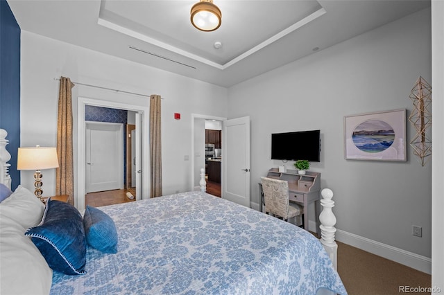 bedroom with a raised ceiling