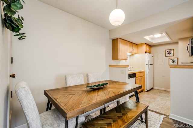 dining space with baseboards