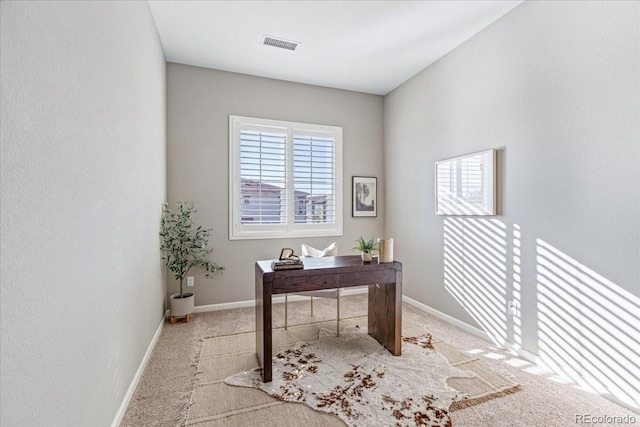 office space with light colored carpet