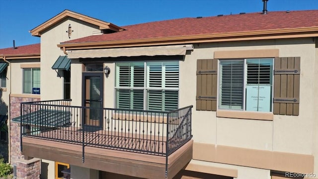 rear view of house with a balcony