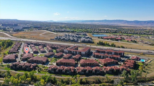 drone / aerial view featuring a mountain view