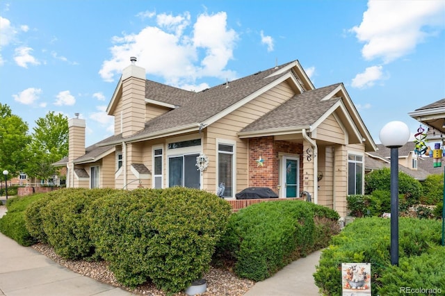 2164 S Troy Way, Aurora, CO 80014 - view of front of property featuring a chimney and a shingled roof