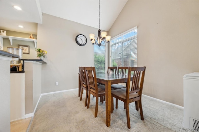 2164 S Troy Way, Aurora, CO 80014 - dining space with a chandelier, baseboards, carpet floors, and lofted ceiling