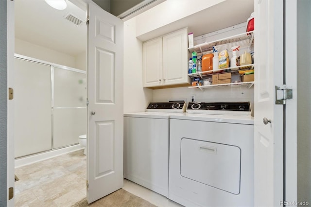 2164 S Troy Way, Aurora, CO 80014 - laundry room featuring cabinet space and independent washer and dryer