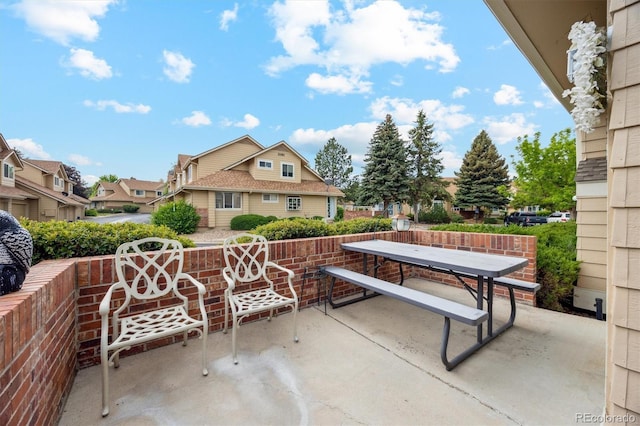 2164 S Troy Way, Aurora, CO 80014 - view of patio featuring outdoor dining space and a residential view
