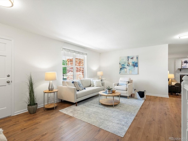 1067 E 15th Ave, Broomfield, CO 80020 - living area featuring wood-type flooring and a fireplace