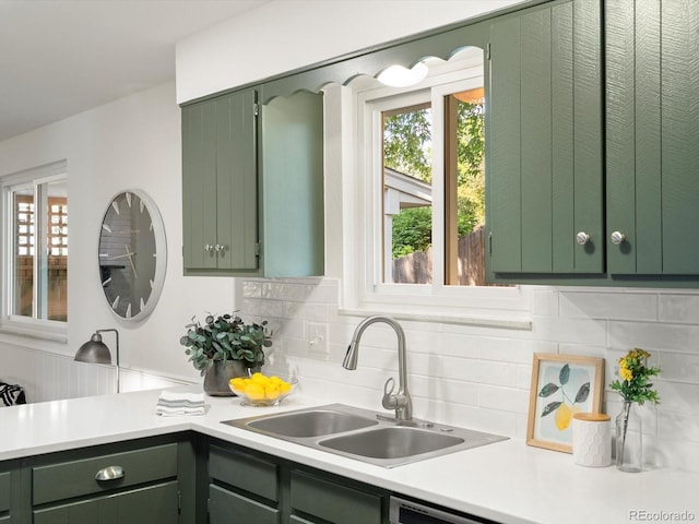 1067 E 15th Ave, Broomfield, CO 80020 - kitchen with green cabinetry, light countertops, and healthy amount of natural light