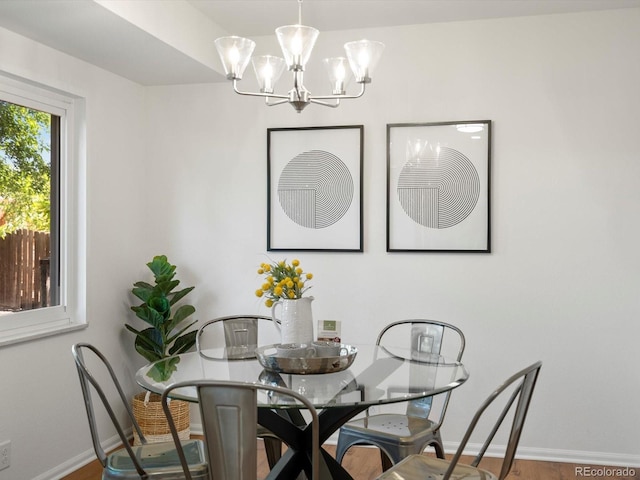 1067 E 15th Ave, Broomfield, CO 80020 - dining space with a chandelier and wood finished floors