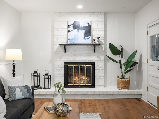 1067 E 15th Ave, Broomfield, CO 80020 - living area featuring wood finished floors and a fireplace