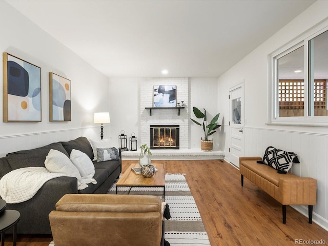 1067 E 15th Ave, Broomfield, CO 80020 - living area featuring wood finished floors, a fireplace, and recessed lighting