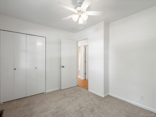 1067 E 15th Ave, Broomfield, CO 80020 - unfurnished bedroom with carpet flooring, a closet, and a ceiling fan